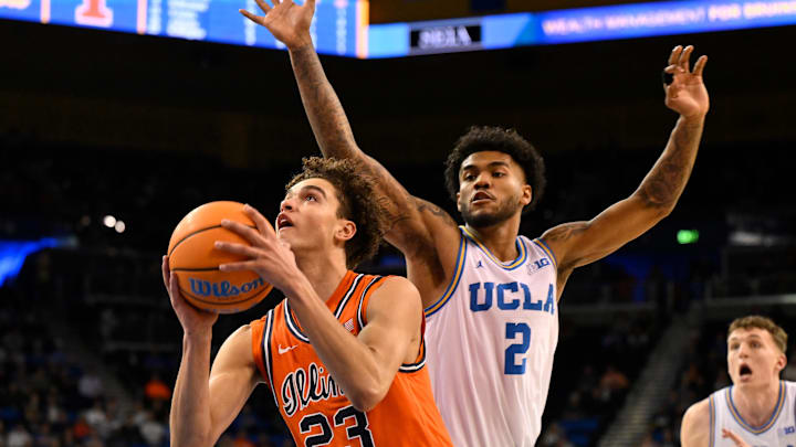 Feb 21, 2026; Los Angeles, California, USA; Illinois guard Keaton Wagler (23) drives to the basket past UCLA guard Donovan Dent (2) during the second half at Pauley Pavilion presented by Wescom Financial. Mandatory Credit: Robert Hanashiro-Imagn Images Feb 21, 2026; Los Angeles, California, USA; Illinois guard Keaton Wagler (23) drives to the basket past UCLA guard Donovan Dent (2) during the second half at Pauley Pavilion presented by Wescom Financial. Mandatory Credit: Robert Hanashiro-Imagn Images