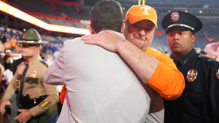 Tennessee coach Josh Heupel and athletic director Danny White celebrate after defeating Florida in an NCAA college football game on November 22, 2025, in Gainesville, Florida.