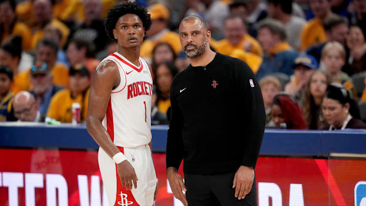 May 2, 2025; San Francisco, California, USA; Houston Rockets forward Amen Thompson (1) meets with Houston Rockets head coach Ime Udoka during a break in the action against the Golden State Warriors in the fourth quarter of game six of the first round for the 2025 NBA Playoffs at Chase Center. Mandatory Credit: Cary Edmondson-Imagn Images