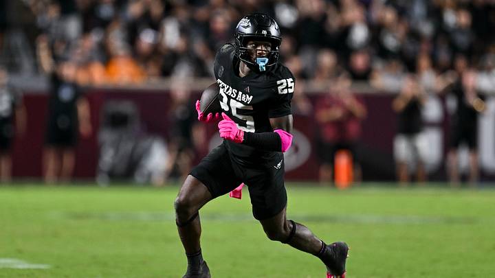 Texas A&M Aggies defensive tackle DJ Hicks (5) runs the ball after a strip sack during the fourth quarter against the Mississippi State Bulldogs at Kyle Field. Texas A&M Aggies defensive tackle DJ Hicks (5) runs the ball after a strip sack during the fourth quarter against the Mississippi State Bulldogs at Kyle Field.