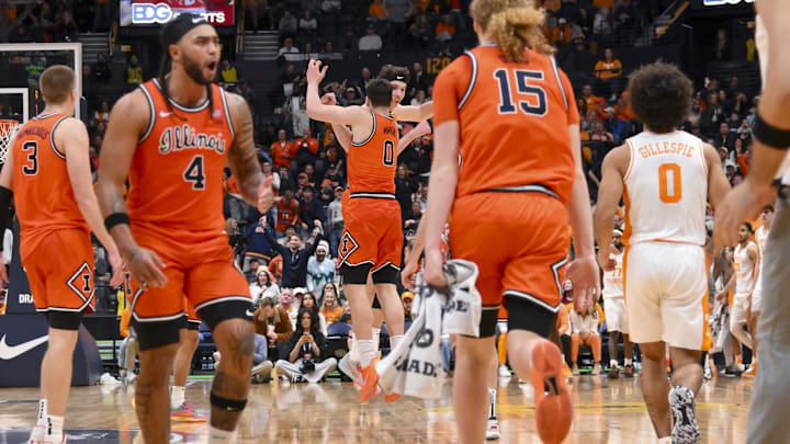 Dec 6, 2025; Nashville, Tennessee, USA;  Illinois Fighting Illini center Zvonimir Ivisic (44) and forward David Mirkovic (0) celebrate after a called time out against the Tennessee Volunteers during the second half at Bridgestone Arena. Mandatory Credit: Steve Roberts-Imagn Images