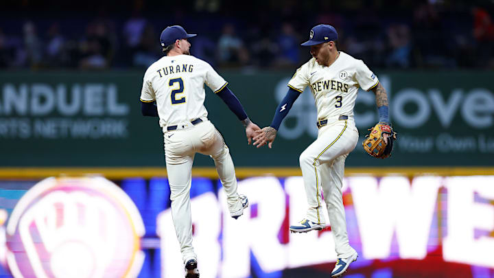 Milwaukee Brewers infielders Brice Turang and Joey Ortiz celebrate against the Los Angeles Angels.