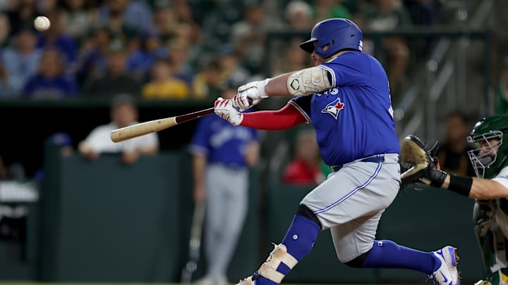 Jul 12, 2025; West Sacramento, California, USA; Toronto Blue Jays designated hitter Alejandro Kirk (30) hits a RBI sacrifice fly against the Athletics during the eighth inning at Sutter Health Park. Jul 12, 2025; West Sacramento, California, USA; Toronto Blue Jays designated hitter Alejandro Kirk (30) hits a RBI sacrifice fly against the Athletics during the eighth inning at Sutter Health Park.