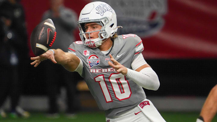 UNLV Rebels quarterback Anthony Colandrea (10) pitches the ball against the Ohio Bobcats during the second half at the Ford Center at The Star. Mandatory Credit: Raymond Carlin III-Imagn Images