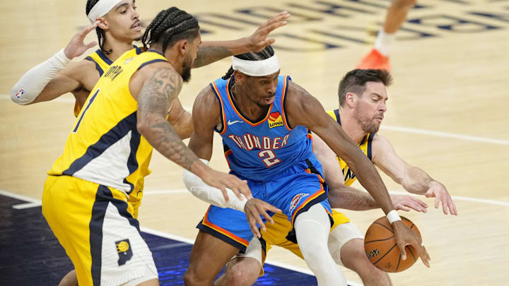 Oklahoma City Thunder guard Shai Gilgeous-Alexander loses control of the ball against Obi Toppin and T.J. McConnell.
