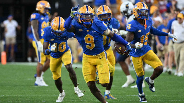 Sep 14, 2024; Pittsburgh, Pennsylvania, USA; Pittsburgh Panthers linebacker Kyle Louis celebrates after intercepting West Virginia Mountaineers quarterback Garrett Greene (6) in the fourth quarter at Acrisure Stadium. Mandatory Credit: Barry Reeger-Image Images Sep 14, 2024; Pittsburgh, Pennsylvania, USA; Pittsburgh Panthers linebacker Kyle Louis celebrates after intercepting West Virginia Mountaineers quarterback Garrett Greene (6) in the fourth quarter at Acrisure Stadium. Mandatory Credit: Barry Reeger-Image Images