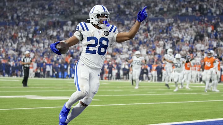 Sep 14, 2025; Indianapolis, Indiana, USA; Indianapolis Colts running back Jonathan Taylor (28) rushes for a touchdown during a game against the Denver Broncos at Lucas Oil Stadium.