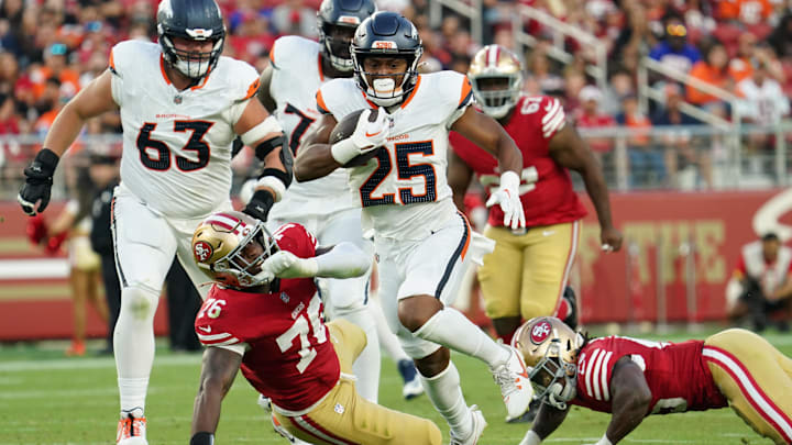 Aug 9, 2025; Santa Clara, California, USA;  Broncos running back Blake Watson (25) rushes the ball past San Francisco 49ers defensive lineman Jaylon Allen (76) in the third quarter at Levi's Stadium. Mandatory Credit: David Gonzales-Imagn Images