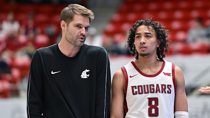Feb 8, 2025; Pullman, Washington, USA; Washington State Cougars head coach David Riley talks with guard Nate Calmese (8) during a game against the Pepperdine Waves in the first half at Friel Court at Beasley Coliseum. Mandatory Credit: James Snook-Imagn Images