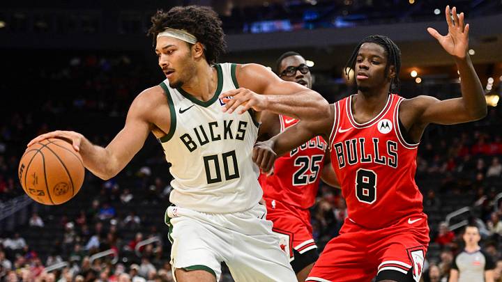 Oct 14, 2026; Milwaukee, Wisconsin, USA;  Milwaukee Bucks center Jericho Sims (00) looks for a shot against Chicago Bulls forward Caleb Wilson (8) in the third quarter at Fiserv Forum.  Mandatory Credit: Benny Sieu-Imagn Images