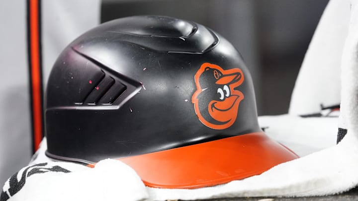 Mar 30, 2025; Toronto, Ontario, CAN; A detail view of a Baltimore Orioles batting helmet during a game against the Toronto Blue Jays at Rogers Centre. Mandatory Credit: John E. Sokolowski-Imagn Images