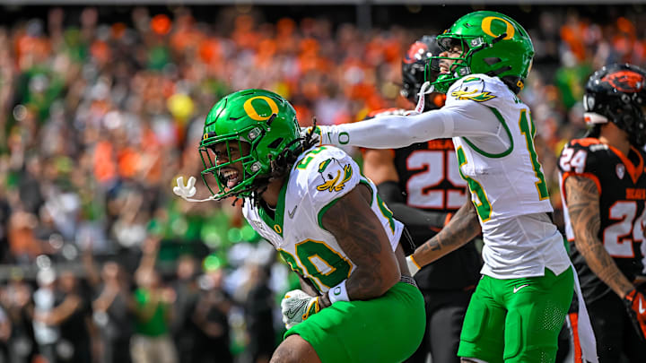 Sep 14, 2024; Corvallis, Oregon, USA; Oregon Ducks running back Jordan James (20) reacts to scoring a touchdown during the first half against the Oregon State Beavers at Reser Stadium. Mandatory Credit: Craig Strobeck-Imagn Images