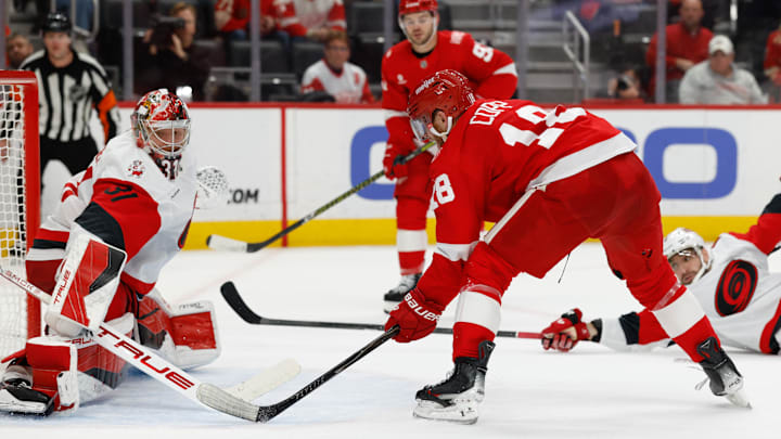 Jan 12, 2026; Detroit, Michigan, USA;  Detroit Red Wings center Andrew Copp (18) scores in overtime against the Carolina Hurricanes at Little Caesars Arena. Mandatory Credit: Rick Osentoski-Imagn Images