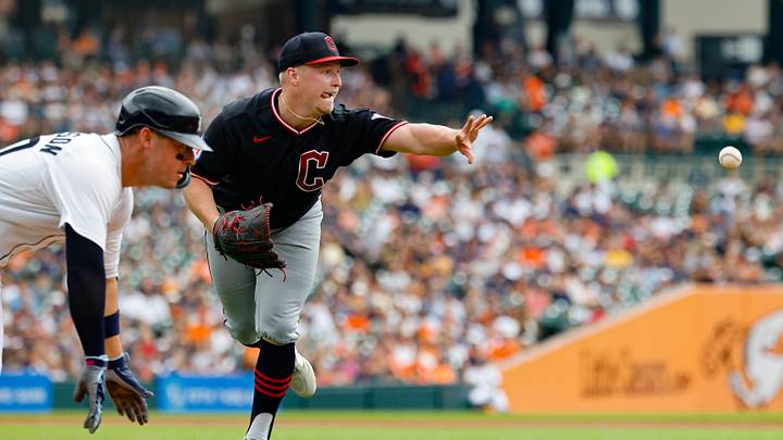 Aug 13, 2026: Cleveland Guardians pitcher Parker Messick (77) tosses to first as Detroit Tigers first baseman Spencer Torkelson (20) dives in safe in the second inning at Comerica Park. Credit: Rick Osentoski-Imagn Images