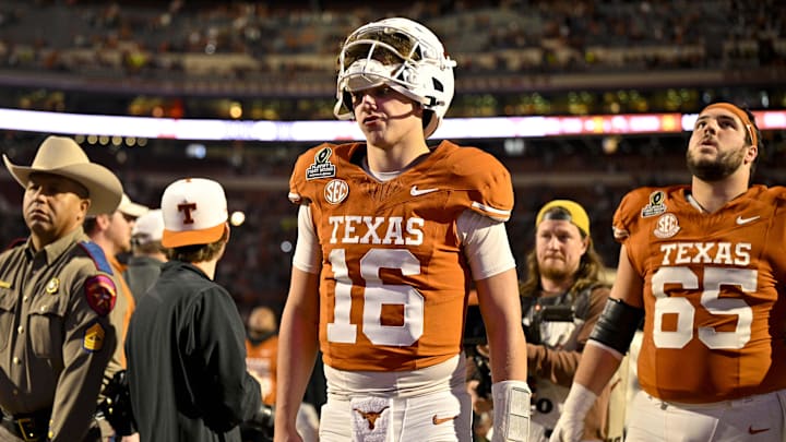 Dec 21, 2024; Austin, Texas, USA; Texas Longhorns quarterback Arch Manning (16) walks off the field after UT defeats the Clemson Tigers in the CFP National Playoff first round game at Darrell K Royal-Texas Memorial Stadium. Mandatory Credit: Jerome Miron-Imagn Images