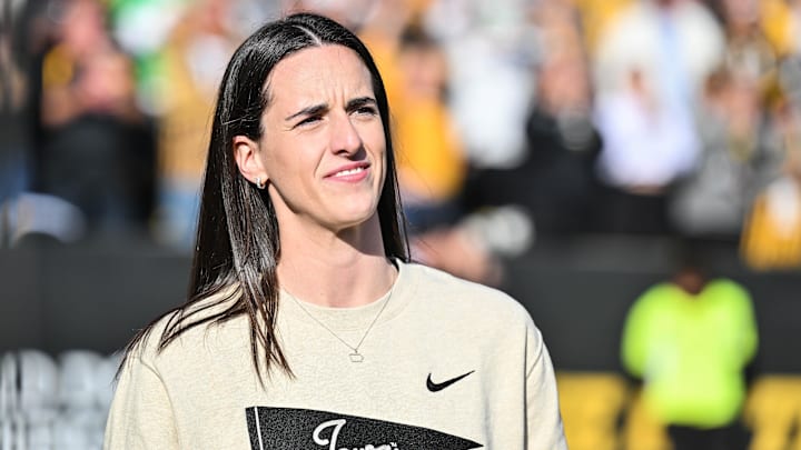 Oct 26, 2024; Iowa City, Iowa, USA; Former Iowa Hawkeye and current Indiana Fever WNBA star Caitlin Clark looks on while being honored during the game between the Iowa Hawkeyes and the Northwestern Wildcats at Kinnick Stadium. Mandatory Credit: Jeffrey Becker-Imagn Images
