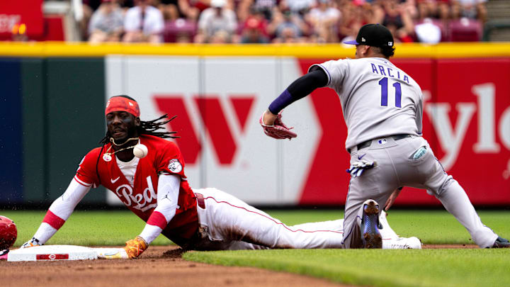 Cincinnati Reds shortstop Elly De La Cruz (44) steals second as Colorado Rockies shortstop Orlando Arcia (11) loses the throw from home in the first inning between Cincinnati Reds and Colorado Rockies at Great American Ball Park in Cincinnati on Saturday, July 12, 2025.