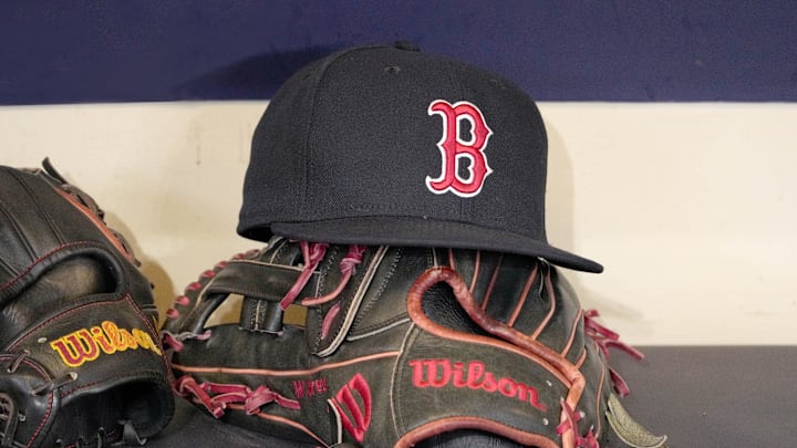 May 27, 2025; Milwaukee, Wisconsin, USA; A Boston Red Sox hat and glove sit in the dug out before a game against the Milwaukee Brewers at American Family Field. Mandatory Credit: Michael McLoone-Imagn Images May 27, 2025; Milwaukee, Wisconsin, USA; A Boston Red Sox hat and glove sit in the dug out before a game against the Milwaukee Brewers at American Family Field. Mandatory Credit: Michael McLoone-Imagn Images