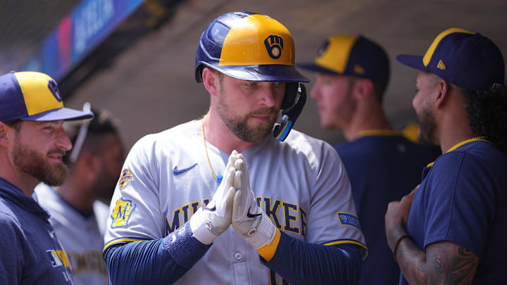 Jun 22, 2025; Minneapolis, Minnesota, USA; Milwaukee Brewers first base Rhys Hoskins (12) celebrates his run against the Minnesota Twins in the second inning at Target Field. Mandatory Credit: Brad Rempel-Imagn Images