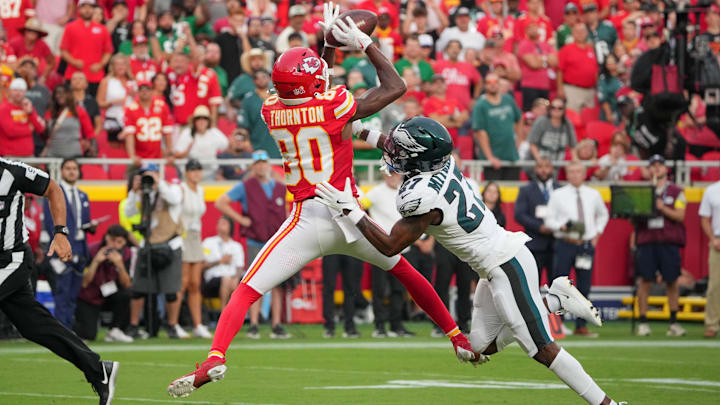 Sep 14, 2025; Kansas City, Missouri, USA; Kansas City Chiefs wide receiver Tyquan Thornton (80) makes a reception for a touchdown defended by Philadelphia Eagles cornerback Quinyon Mitchell (27) during the fourth quarter of the game at GEHA Field at Arrowhead Stadium. Mandatory Credit: Denny Medley-Imagn Images