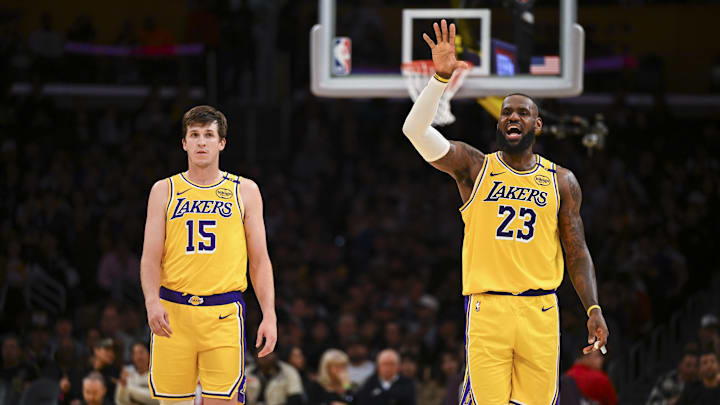 Nov 8, 2024; Los Angeles, California, USA; Los Angeles Lakers guard Austin Reaves (15) and forward LeBron James (23) on the court against the Philadelphia 76ers during the second half at Crypto.com Arena. Mandatory Credit: Jonathan Hui-Imagn Images