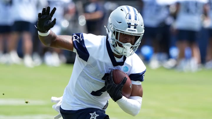 Dallas Cowboys receiver Traeshon Holden carries the ball during training camp at the River Ridge Fields.