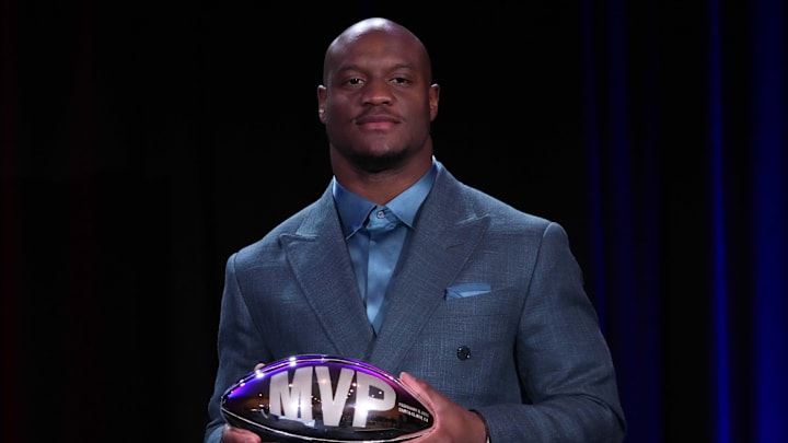Feb 9, 2026; San Francisco, CA, USA; Seattle Seahawks running back Kenneth Walker III poses with the MVP trophy during the Super Bowl LX winning head coach and most valuable player press conference at Moscone Center.