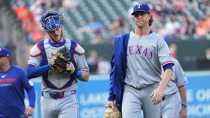 Jun 25, 2025; Baltimore, Maryland, USA; Texas Rangers pitcher Jacob DeGrom (right) and catcher Jonah Heim (left) prior to the game against the Baltimore Orioles at Oriole Park at Camden Yards. 