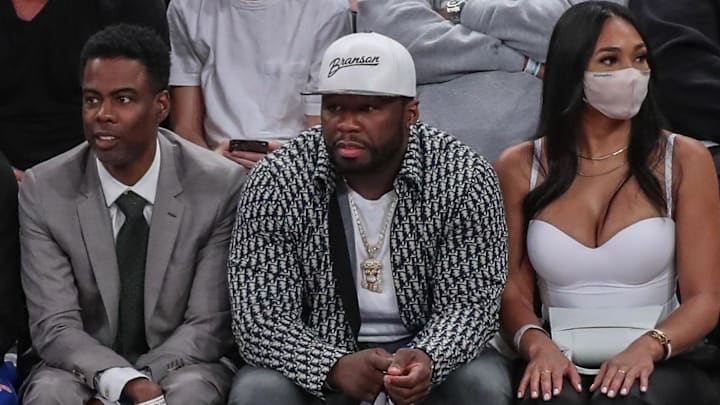 Jun 2, 2021; New York, New York, USA;  Comedian and actor Chris Rock (left) and rapper and actor 50 Cent (center) during game five in the first round of the 2021 NBA Playoffs at Madison Square Garden. Mandatory Credit: Wendell Cruz-Imagn Images