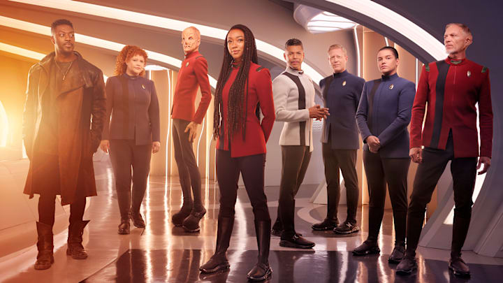 L-R David Ajala as Book, Mary Wiseman as Tilly, Doug Jones as Saru, Sonequa Martin-Green as Burnham, Wilson Cruz as Culber, Blu Del Barrio as Adira and Callum Keith Rennie as Raynor in season 5 of the Paramount+ original series STAR TREK: DISCOVERY. Photo Credit: James Dimmock/Paramount+