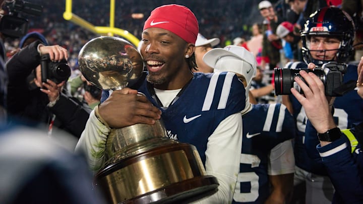 Mississippi's cornerback Isaiah Hamilton (3) holds the Golden Egg trophy after they won the Egg Bowl game against Mississippi State at Vaught-Hemingway Stadium on Friday, Nov. 29, 2024.