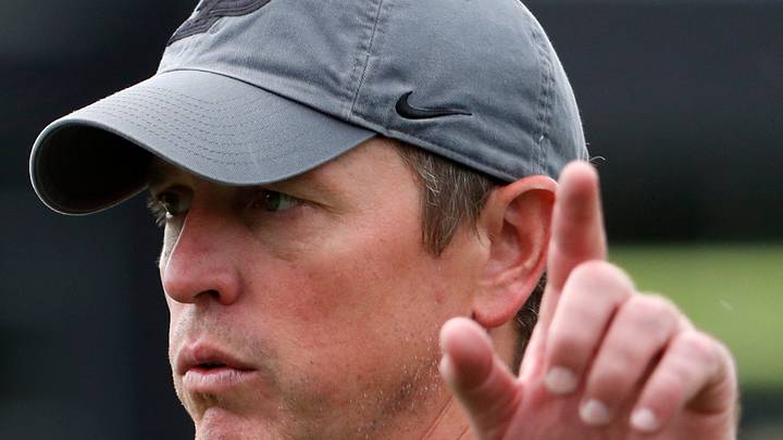 Purdue Boilermakers defensive coordinator Kevin Kane points down field. Purdue Boilermakers defensive coordinator Kevin Kane points down field.