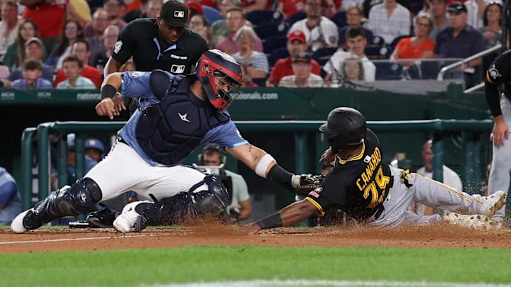 Sep 12, 2025; Washington, District of Columbia, USA; Washington Nationals catcher Jorge Alfaro (44) tags out Pittsburgh Pirates outfielder Alexander Canario (29) at home plate on a throw by Nationals outfielder James Wood (not pictured) during the ninth inning at Nationals Park. Mandatory Credit: Geoff Burke-Imagn Images