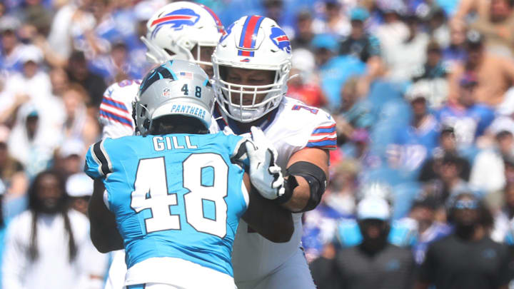 Bills Ryan Van Demark keeps Panthers Cam Gill away from back up quarterback Ben DiNucci during the first half of the preseason game against Carolina Panthers.