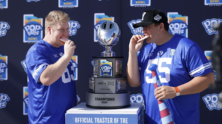 BYU offensive linemen Bruce Mitchell and Austin Leausa