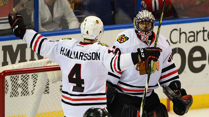 Nov 14, 2015; St. Louis, MO, USA; Chicago Blackhawks goalie Corey Crawford (50) and defenseman Niklas Hjalmarsson (4) celebrate after defeating the St. Louis Blues 4-2 at Scottrade Center. Mandatory Credit: Jeff Curry-Imagn Images Nov 14, 2015; St. Louis, MO, USA; Chicago Blackhawks goalie Corey Crawford (50) and defenseman Niklas Hjalmarsson (4) celebrate after defeating the St. Louis Blues 4-2 at Scottrade Center. Mandatory Credit: Jeff Curry-Imagn Images
