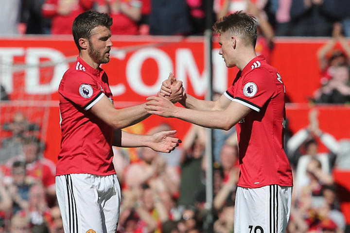 ไมเคิล แคร์ริค (ซ้าย) และสก็อตต์ แมคโทมิเนย์