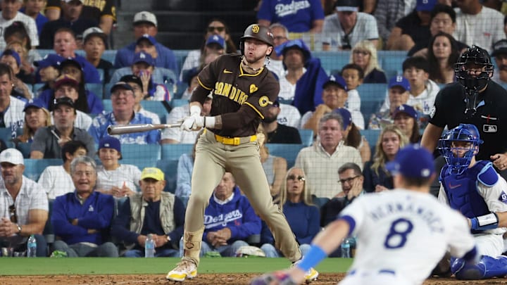 Oct 6, 2024; Los Angeles, California, USA; San Diego Padres outfielder Jackson Merrill (3) hits an RBI single in the sixth inning against the Los Angeles Dodgers during Game 2 of the NLDS for the 2024 MLB Playoffs at Dodger Stadium.