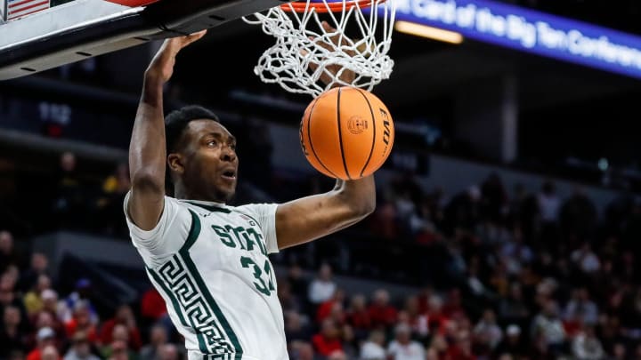 Michigan State forward Xavier Booker (34) dunks against Minnesota during the first half of Second Round of Big Ten tournament at Target Center in Minneapolis, Minn. on Thursday, March 14, 2024.