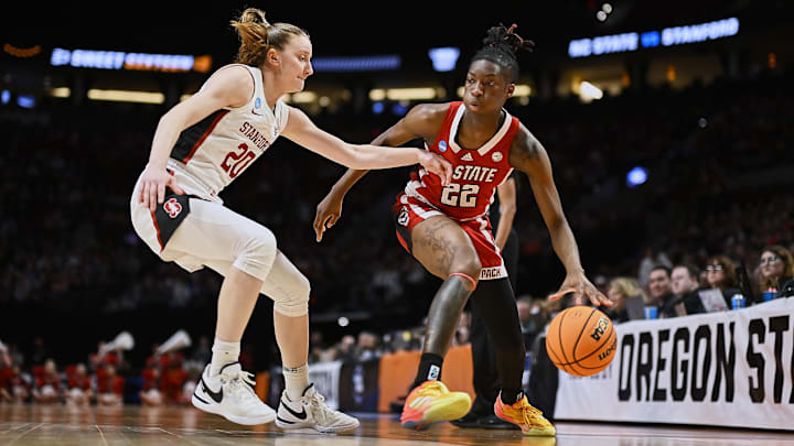 Mar 29, 2024; Portland, OR, USA; NC State Wolfpack guard Saniya Rivers (22) drives to the basket during the first half against Stanford Cardinal guard Elena Bosgana (20) in the semifinals of the Portland Regional of the 2024 NCAA Tournament at the Moda Center at the Moda Center. Mandatory Credit: Troy Wayrynen-Imagn Images Mar 29, 2024; Portland, OR, USA; NC State Wolfpack guard Saniya Rivers (22) drives to the basket during the first half against Stanford Cardinal guard Elena Bosgana (20) in the semifinals of the Portland Regional of the 2024 NCAA Tournament at the Moda Center at the Moda Center. Mandatory Credit: Troy Wayrynen-Imagn Images