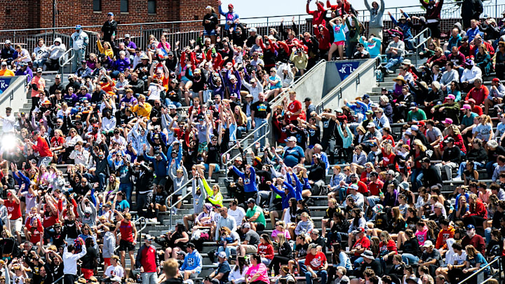 Fans cheer on the athletes at the Iowa high school state track and field championships.