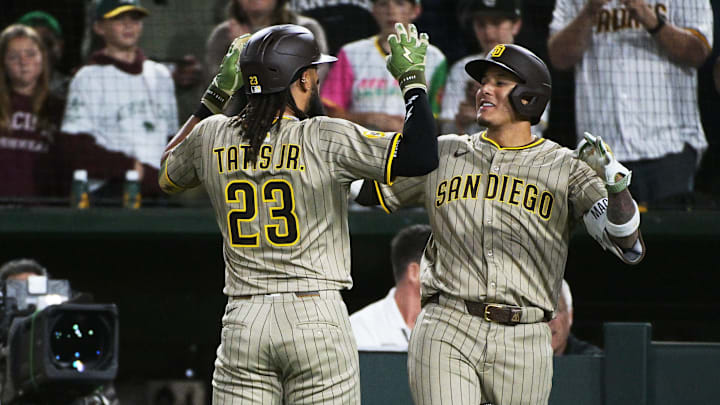 Apr 7, 2025; West Sacramento, California, USA; San Diego Padres outfielder Fernando Tatis Jr. (23) celebrates with third base Manny Machado (13) after hitting a home run against the Athletics during the sixth inning at Sutter Health Park. Mandatory Credit: Ed Szczepanski-Imagn Images