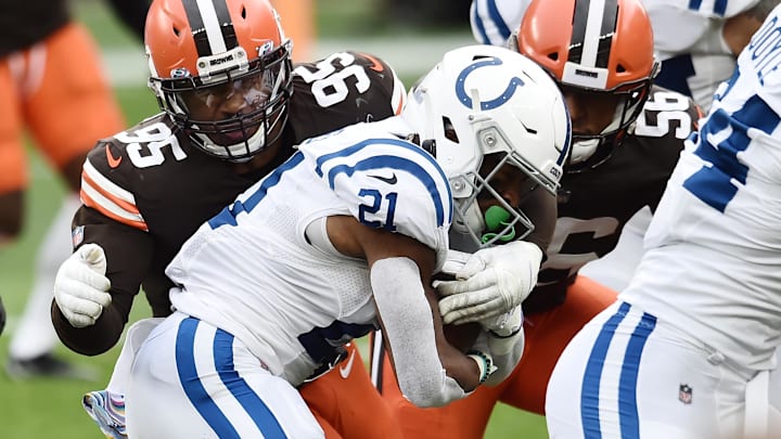 Oct 11, 2020; Cleveland, Ohio, USA; Cleveland Browns defensive end Myles Garrett (95) tackles Indianapolis Colts running back Nyheim Hines (21) during the first half at FirstEnergy Stadium. Mandatory Credit: Ken Blaze-Imagn Images