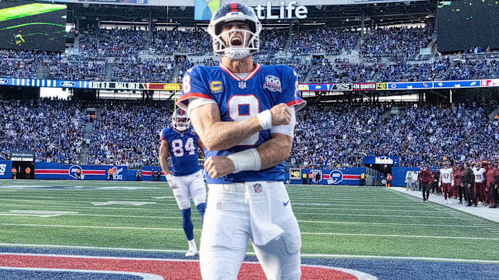 Nov 3, 2024; East Rutherford, New Jersey, USA; New York Giants quarterback Daniel Jones (8) celebrates after scoring a 2nd half touchdown against the Washington Commanders at MetLife Stadium. Mandatory Credit: Robert Deutsch-Imagn Images