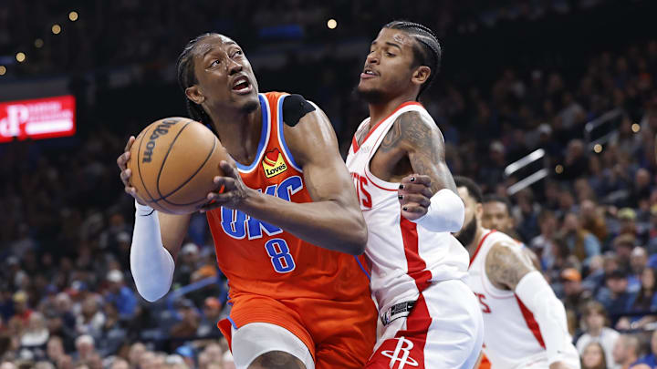 Nov 8, 2024; Oklahoma City, Oklahoma, USA; Oklahoma City Thunder forward Jalen Williams (8) drives to the basket against Houston Rockets guard Jalen Green (4) during the second quarter at Paycom Center. Mandatory Credit: Alonzo Adams-Imagn Images