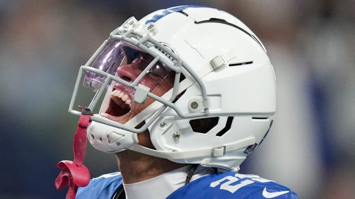 Indianapolis Colts cornerback JuJu Brents (29) yells in excitement after bringing down Pittsburgh Steelers running back Najee Harris (22) on the line of scrimmage Saturday, Dec. 16, 2023, during a game against the Pittsburgh Steelers at Lucas Oil Stadium in Indianapolis.