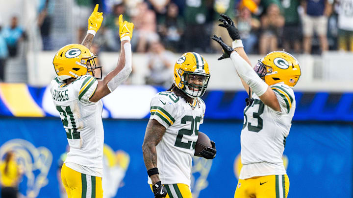 Green Bay Packers cornerback Eric Stokes (L), safeties...