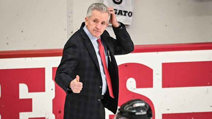Wisconsin Badgers head coach Mark Johnson acknowledges an official after an 11-0 victory against the Bemidji State Beavers in a WCHA first-round game Saturday, March 1, 2025, at LaBahn Arena in Madison, Wisconsin.