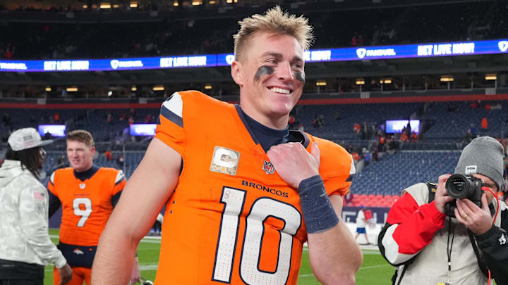 Nov 17, 2024; Denver, Colorado, USA; Denver Broncos quarterback Bo Nix (10) reacts following the win over the Atlanta Falcons at Empower Field at Mile High. 