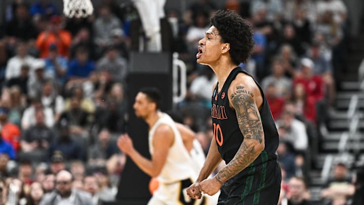 Mar 22, 2026; St. Louis, MO, USA; Miami Hurricanes guard Tru Washington (10) celebrates after a play during the first half against the Purdue Boilermakers during a second round game of the men's 2026 NCAA Tournament at Enterprise Center. Mandatory Credit: Jeff Le-Imagn Images